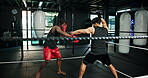 Athlete, men and fight with coach in boxing ring for fitness, sports training and sparring practice. People, punch and combat for exercise, mma performance and match preparation of battle competition