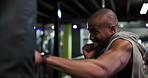 Boxing, fitness and punching bag with black man in gym for combat sports, fight or workout. Exercise, technique and training with athletic boxer in health club for conditioning, skill or strength