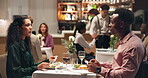 Eating, couple and people on date, restaurant and celebration of anniversary with meal and together. Happy, man and woman with cuisine for romance, bonding and smile for fine dining, diner or weekend