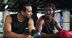 Advice, sports men and talking in boxing ring at gym together for exercise, fitness or training. Break, conversation and workout with boxer friends in health club for coaching, discussion or review
