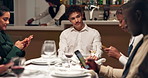 Ignore, antisocial and man with friends in restaurant with phone for social media, internet or website. Sad, diner and lonely person with people on smartphone for online addiction, text and contact