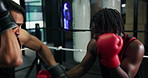 Men, boxer and fight with coach in boxing ring for fitness, sports training and sparring practice. People, punch and defence for exercise, mma performance and match preparation for battle competition