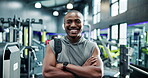 Arms crossed, face and fitness with black man in gym for training or workout as happy athlete. Exercise, smile and wellness with sports person in health club for development, performance or progress
