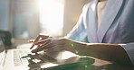 Laptop, business woman and hands typing email for insurance sales, policy or review in office. Keyboard, writing and worker at desk for project, risk management or coverage with report for claims
