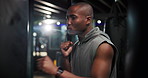 Boxing, fitness and black man in gym for training, cardio or workout for MMA fight with challenge. Practice, exercise and African male athlete with technique for self defense at sports center.