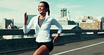 Fitness, running and woman on bridge in city for race, marathon or competition training. Happy, sports and female athlete with outdoor cardio exercise, workout or challenge on highway in urban town.