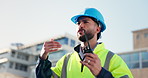 Talking, engineer and man with radio, outdoor and communication for project management and planning. Construction worker, employee and person with tech for architecture, conversation and progress