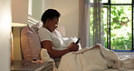 Smile, smartphone and black woman in bedroom, internet or connection with message to contact. African person, home or chatting with cellphone, funny video or texting with app, meme or social media