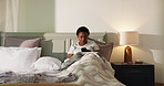 Relax, phone and black woman in bed in home for social media, online post and internet in bedroom. Apartment, comfortable and person with blanket on smartphone for reading website, news and message