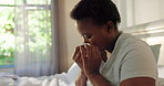 Sick, bed and black woman blowing nose in home for flu, cold or seasonal allergies with symptoms. Tissue, illness and African female person with sneeze, hayfever or disease in bedroom in house.