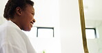 Black woman, check or smile for skincare in bathroom for natural beauty, self care or cleaning results. Confidence, face and mirror in home for cosmetic benefits, facial inspection and treatment glow