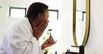 Beauty, bathroom and woman with jade roller in mirror for skincare routine, check results and happy. Inspection, black person and cosmetics product in home for lymphatic drainage and anti aging glow