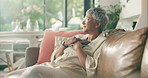 Phone, think and senior woman in home for emotional message, love or typing text for online dating. Mobile, smile and person on sofa in retirement for reflection, nostalgia or romantic memory