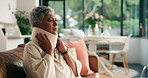 Neck brace, home and senior woman with injury, discomfort and morning with recovery. Apartment, pensioner and elderly person in living room, inflammation and rehabilitation with retirement and broken
