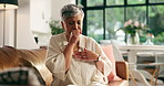 Sick, senior woman and cough in home with chest pain, pneumonia infection and tired breathing. Retirement, old person and sore throat with lung disease, airway inflammation and health issue on sofa