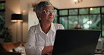 Laptop, thinking and mature woman in home office for inspiration, remote work or idea for ebook. Computer, happy freelancer and thoughts with vision, brainstorming and author with insight for story