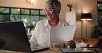 Documents, laptop and mature woman in home for finance planning with retirement plan. Laugh, paperwork and female person with financial report for pension funds and payment on mortgage in house.
