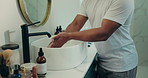 Wellness, cleaning and man washing hands in bathroom for hygiene, care and germ prevention. Basin, sanitary and person in home with disinfection or healthy habit for protection from bacteria or virus
