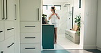 Woman, bathroom and hair curlers in mirror for heatless styling, getting ready and morning routine. Natural beauty, person and haircare in home for self care maintenance, grooming and pinup curls