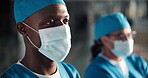 Face mask, surgeon and doctor confident in hospital for healthcare, wellness and safety. Woman, man and medical professional group with ppe, scrubs and surgery employee for support, help and clinic