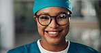 Face mask, surgeon and woman with smile in hospital for healthcare, wellness and safety. Portrait, doctor and medical professional with ppe, scrubs and surgery employee for support, help and clinic