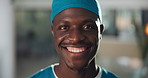 Happy, black man and face of surgeon in hospital with confidence for medical support career. Smile, mask and portrait of African male doctor from Kenya with pride for healthcare service in clinic.