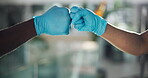 Fist bump, teamwork and healthcare with hands of doctors in hospital for partners, trust and respect. Medical, support and synergy with closeup of people in clinic for surgery, solidarity and deal