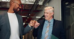Businessmen, smile and walking with fist bump for greeting, good job or well done together at office. Male people, employees or friendly handshake for business deal, partnership or b2b agreement