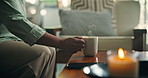 Relax, hands and coffee break with person on sofa in lounge for peace, calm and caffeine beverage. Hot drink, espresso and morning with phone in home living room for latte, weekend and wellness