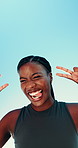Outdoor, black woman and silly with peace sign after fitness, running challenge and flirt with kiss. Blue sky, female person and runner with exercise break for tongue out, goofy and happy from below