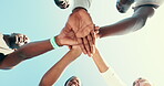 Runner, motivation and low angle with hands of people for fitness, teamwork and support. Training club, group of below of friends in outdoor running community for partnership, sports and wellness