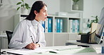 Doctor, computer and woman writing notes for prescription, health report or research. Desktop, paper and medical professional with healthcare info, schedule or check results for diagnosis in clinic