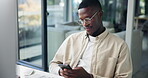 Black man, phone and typing in office for networking, business research and schedule update. Creative writer, SEO and employee with mobile for news search, latest trends and connection at computer