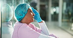 Headache, doctor and woman in hospital, stress and overwhelmed with injury. Mature person, medical expert and professional in clinic, migraine and burnout with muscle tension, joint strain and spasm