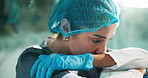 Upset, doctor and woman in hospital with stress in hallway for patient loss, mistake and medical crisis. Healthcare, surgeon and sad person on floor with burnout, bad news and pressure in surgery