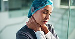 Neck pain, doctor and woman in hospital, stress and overwhelmed with fatigue. Mature person, medical expert and professional in clinic, anxiety and burnout with muscle tension, joint injury and spasm