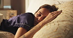 Sleeping, tired and woman on bed with peace, calm and dreaming in bedroom with pillow in apartment. Nap, relax and cozy rest on mattress with fatigue, morning comfort and weekend break in house
