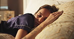 Sleeping, rest and woman on bed with peace, calm and dreaming in bedroom with pillow in apartment. Nap, tired and cozy relax on mattress with fatigue, morning comfort and weekend break in house