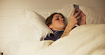 Wake up, woman and phone on bed with social media, text or browse in bedroom with pillow in apartment. Internet, relax and cozy rest on mattress with morning, routine and weekend break in house