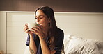 Coffee, relax and smile with woman in bedroom for morning,  thinking and reflection. Happiness, calm and drinking tea with person and caffeine mug in home for inspiration, wellness and vision