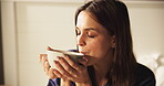 Coffee, thinking and peace with woman in bedroom for morning, smile and reflection. Happiness, calm and drinking tea with person and caffeine mug in home for inspiration, wellness and vision