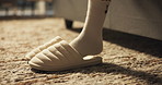 House, plush slippers and woman in bedroom, feet and fashion with comfort, bed rest and morning. Closeup, apartment and person with shoes, footwear on rug and start day with style and waking up