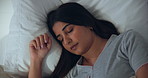 Sleeping, home and woman in bed for rest, dreaming or peaceful morning with fatigue on weekend. Tired, exhausted and female person with nap in bedroom for relax on pillow for comfort in apartment.