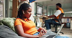 College student, laptop and video call with earphones in library for tutorial, discussion or class. Education, bean bag and girl with webinar for online course, virtual lesson and elearning platform