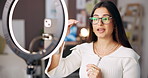 Influencer, ring light and woman in home talking for online podcast, broadcast and live streaming. Content creation, bedroom and person with advice for social media, recording and post for audience 