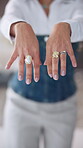 Hands, woman and fashion with designer rings for getting ready, quality check and styling tips. Female person, closeup and crafted jewellery to advertise brand, luxury accessories and statement piece