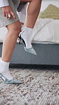 Legs, stiletto and rush for getting ready in home with fashion, floor and start morning in bedroom. Person, shoes and high heels with trendy style on carpet, feet and late for date at apartment