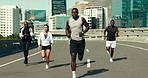 Coach, man and group with running in city, clapping and motivation for fitness, speed and training. People, mentor and support with race, workout and guide for challenge with exercise club on bridge