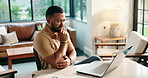 Documents, laptop and thinking with freelance man in home office for budget or financial report. Computer, problem solving and reading with remote work person in apartment for finance or investment