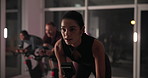 Ebike, people and woman in gym, training and endurance with cardio, challenge and body workout. Group, person and sweating in wellness center, energy and exercise machine with fitness and healthy